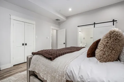 a bedroom with a bed and a dresser