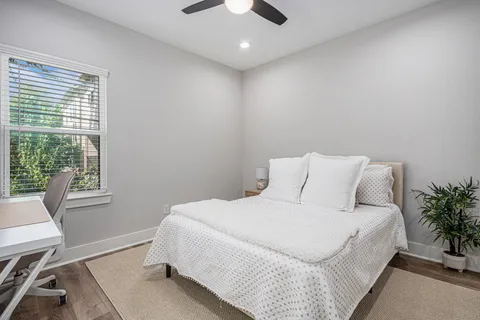 a large white bed in a white room