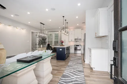 a kitchen with a sink a counter top space and appliances