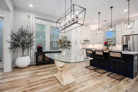 a view of a living room and kitchen