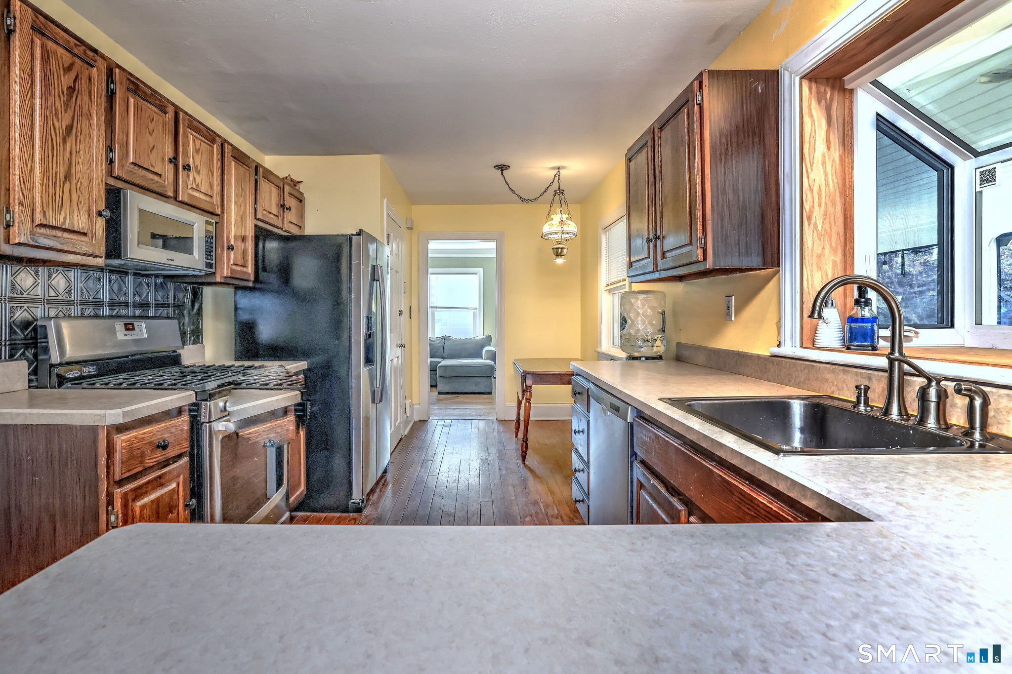 51 Joy Road Waterbury, CT 06708 - Photo 17 of 39 a kitchen with stainless steel appliances granite countertop a sink a stove and a refrigerator