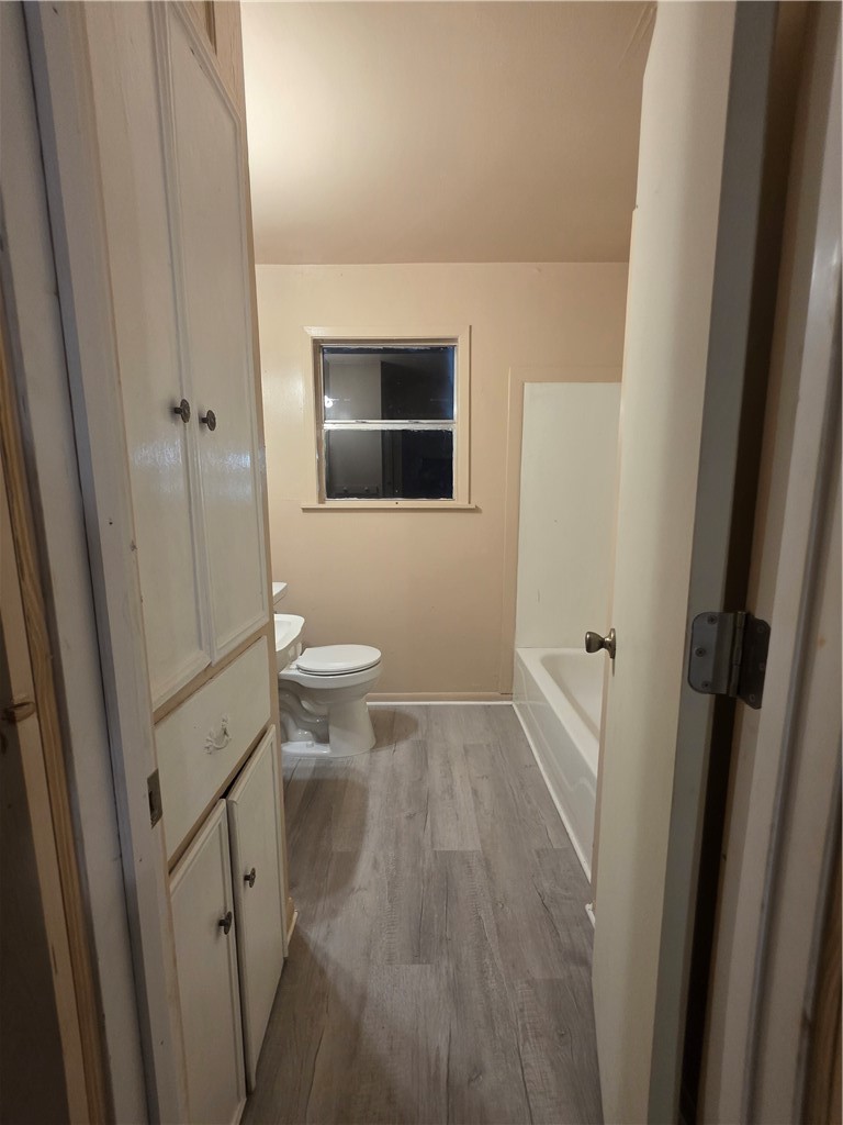 a bathroom with a sink and toilet
