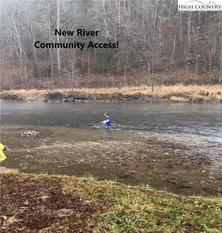 Lot 104 Deer Path Road Crumpler, NC 28617 - Photo 16 of 26 a swimming pool with trees in front of it