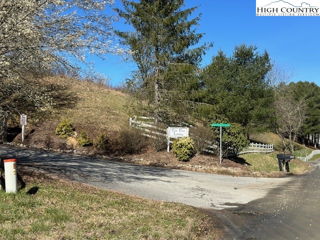 Lot 104 Deer Path Road Crumpler, NC 28617 - Photo 25 of 26 a view of a yard with wooden fence