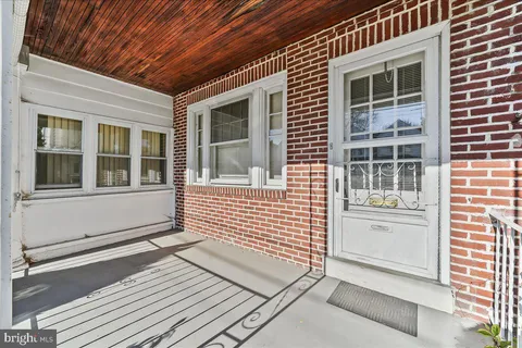 a view of a brick house with an outdoor space