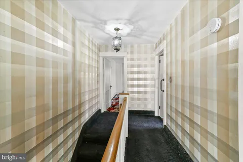 a view of a bathroom with a shower curtain