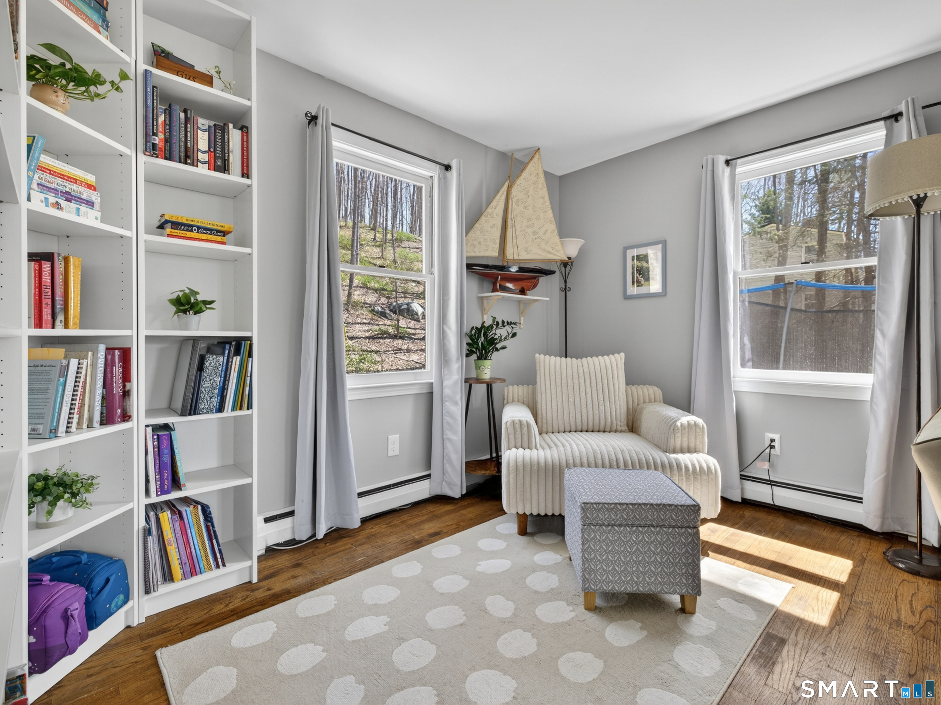 599 Durham Road Guilford, CT 06437 - Photo 19 of 42 a living room with furniture and a book shelf