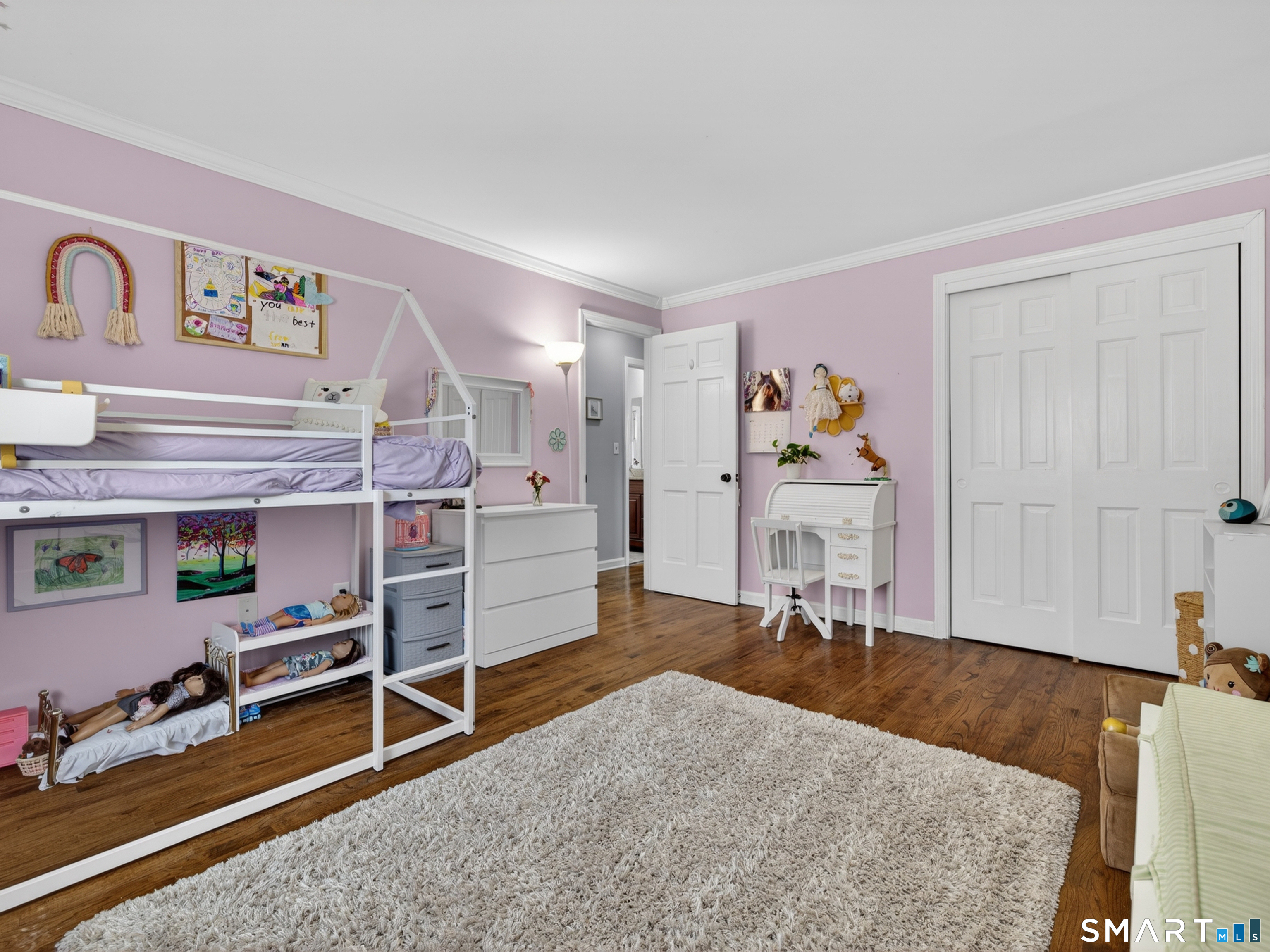 599 Durham Road Guilford, CT 06437 - Photo 30 of 42 a view of a bedroom with baby crib and furniture