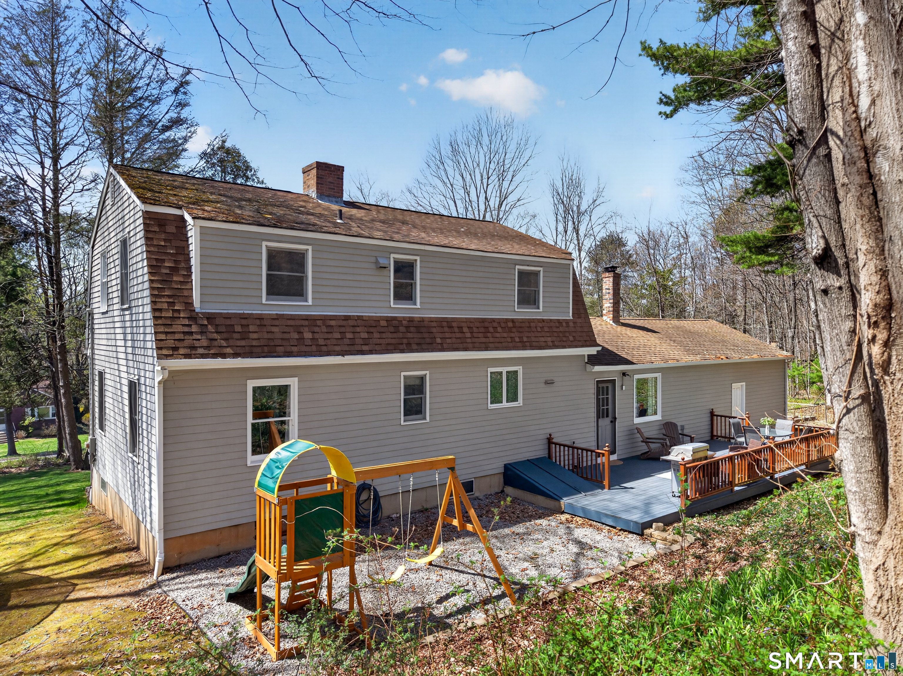 599 Durham Road Guilford, CT 06437 - Photo 41 of 42 a view of a house with backyard sitting area and tub