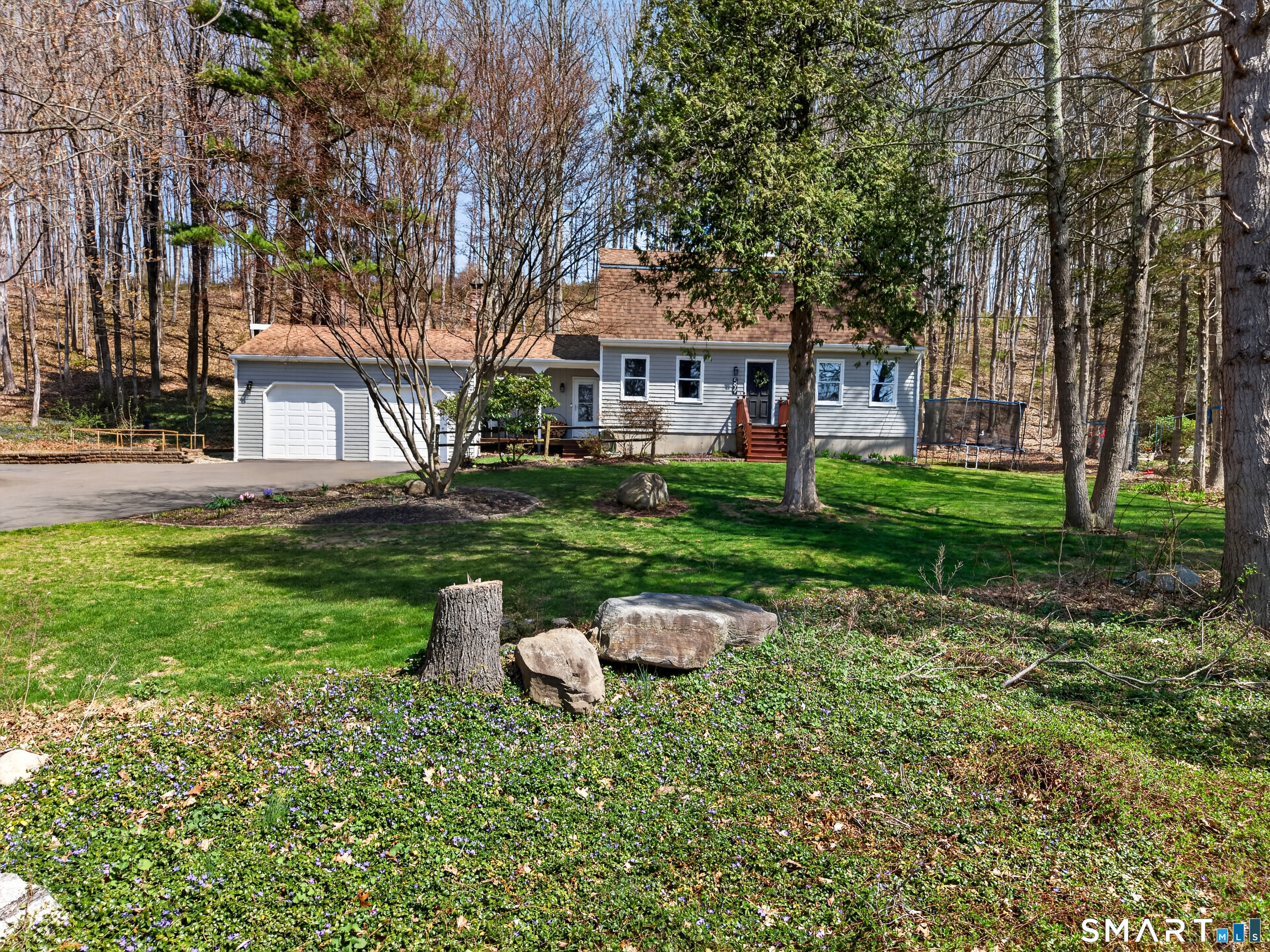 599 Durham Road Guilford, CT 06437 - Photo 6 of 42 a backyard of a house with table and chairs