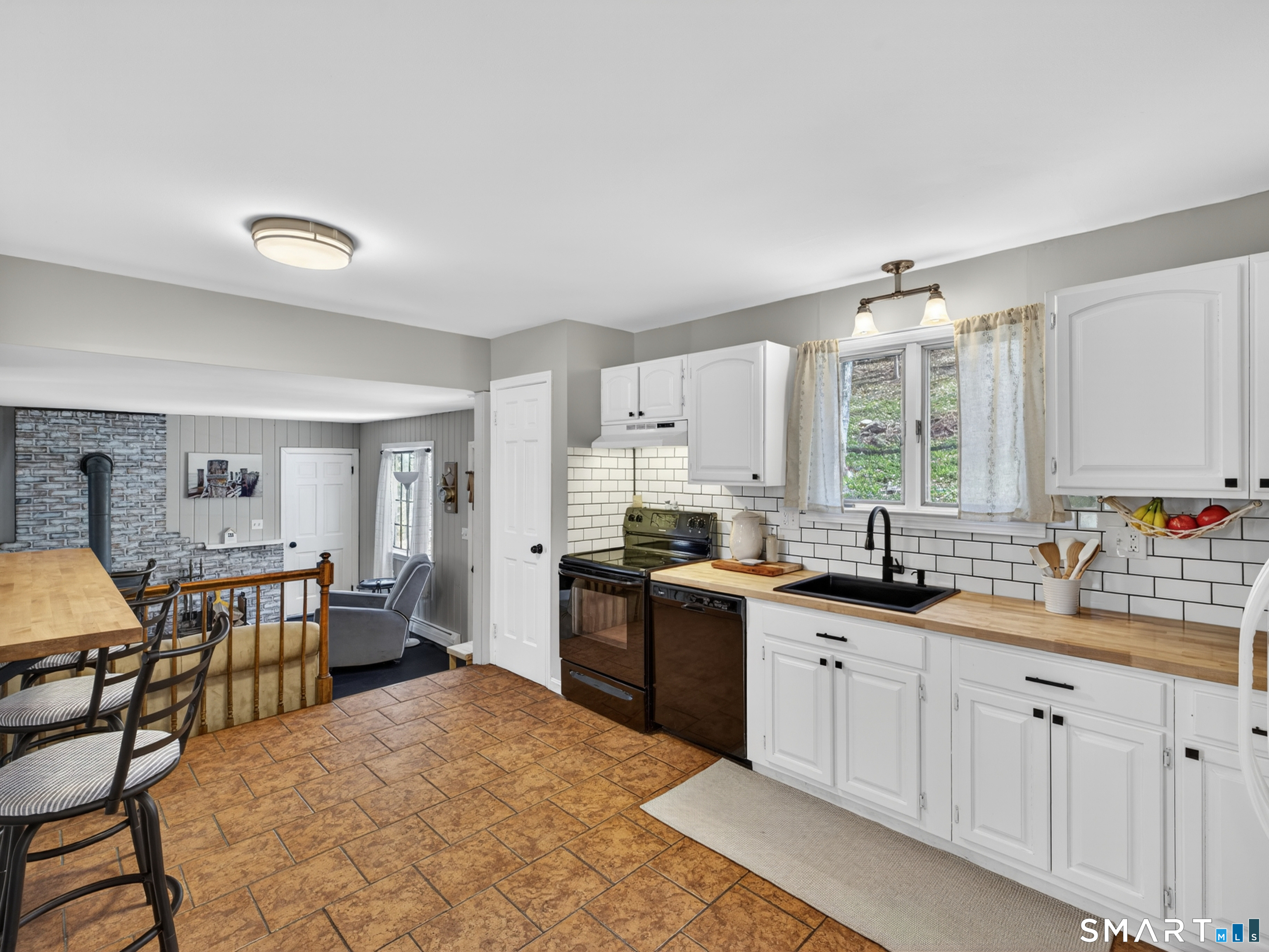 599 Durham Road Guilford, CT 06437 - Photo 10 of 42 a kitchen with stainless steel appliances granite countertop a sink and cabinets