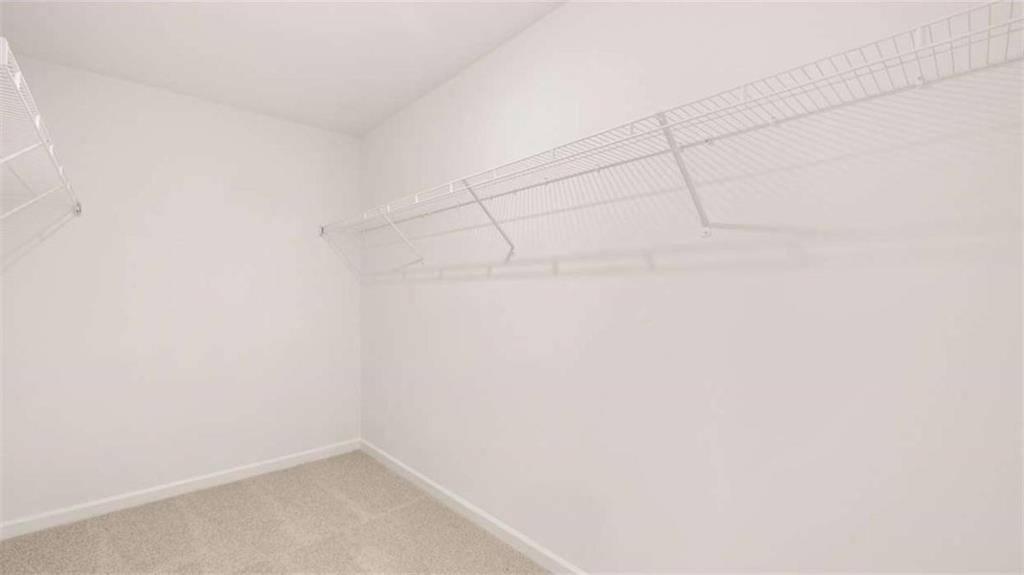 2291 Edgecombe Lane Dacula, GA 30019 - Photo 24 of 42 a view of a room with racks on the wall
