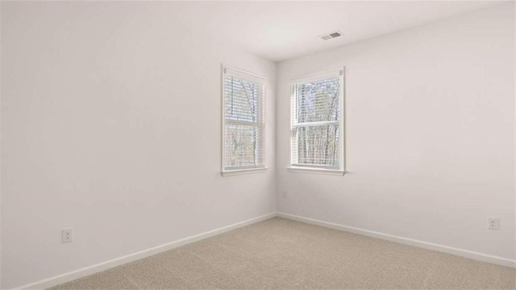 2291 Edgecombe Lane Dacula, GA 30019 - Photo 25 of 42 an empty room with windows