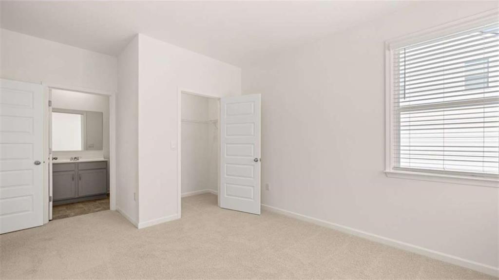 2291 Edgecombe Lane Dacula, GA 30019 - Photo 26 of 42 an empty room with windows