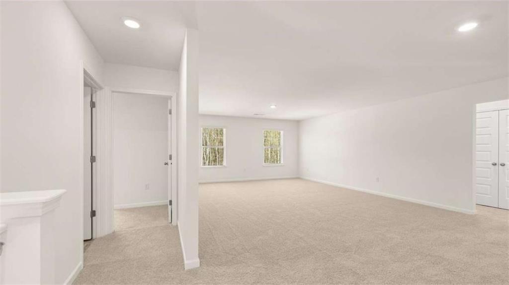 2291 Edgecombe Lane Dacula, GA 30019 - Photo 27 of 42 an empty room with windows and closet