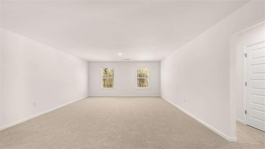 2291 Edgecombe Lane Dacula, GA 30019 - Photo 28 of 42 an empty room with windows