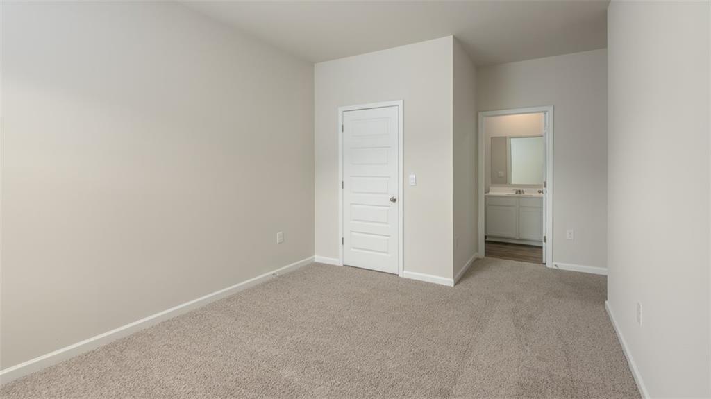 2291 Edgecombe Lane Dacula, GA 30019 - Photo 39 of 42 an empty room with an entryway