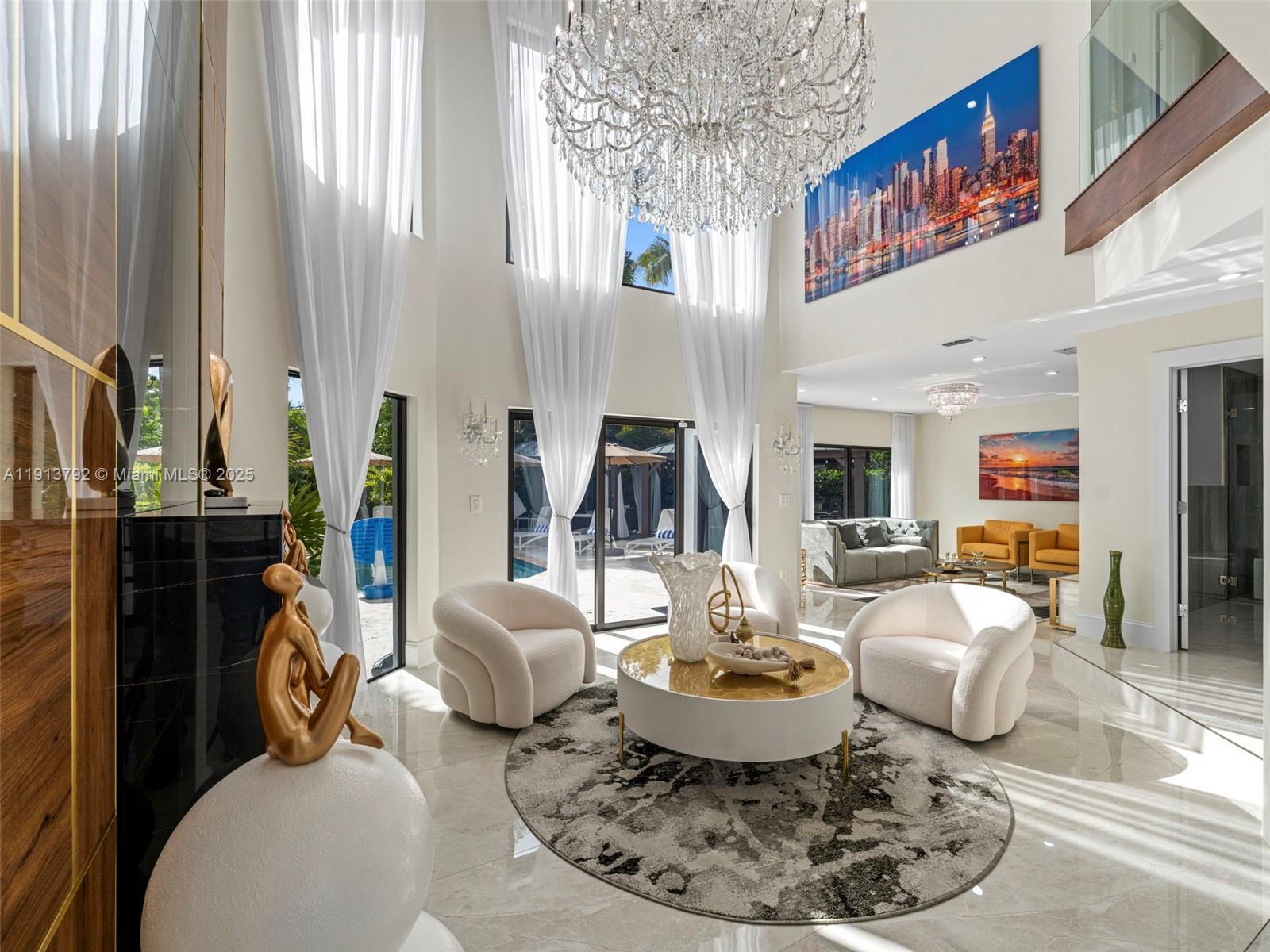 6180 Pine Tree Drive Miami Beach, FL 33140 - Photo 11 of 100 a living room with furniture flowerpot and a table