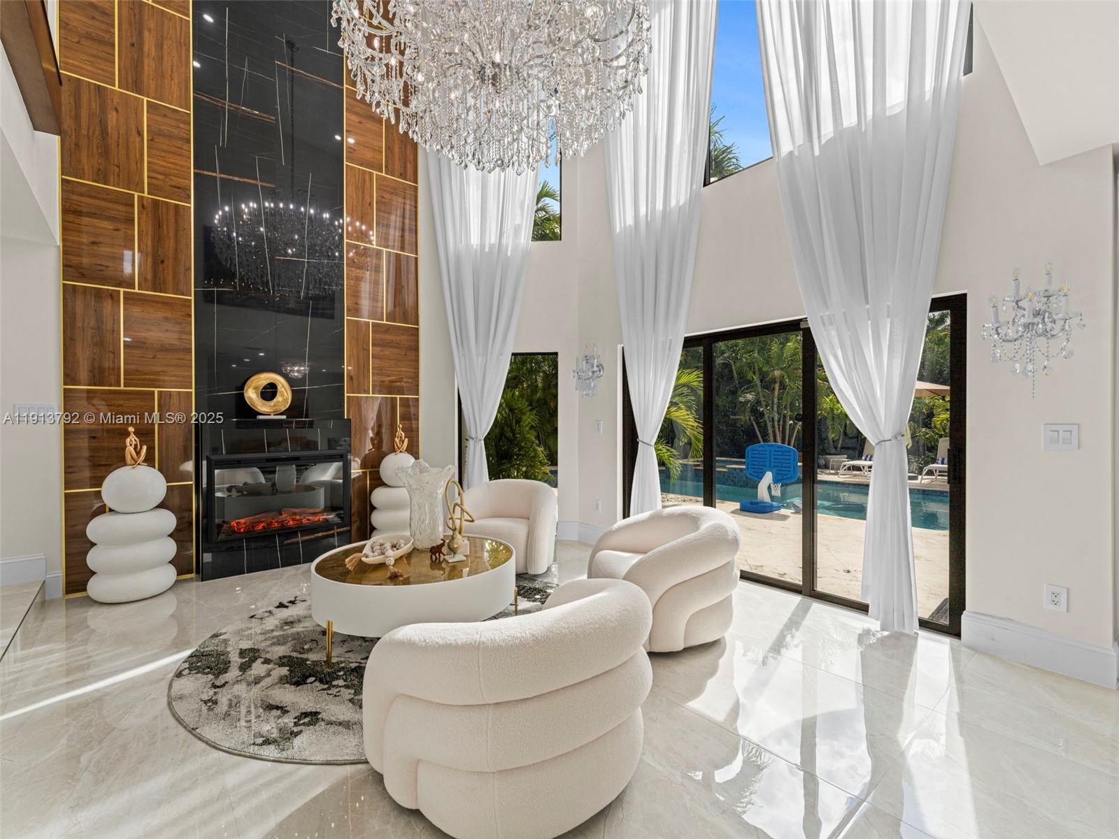 6180 Pine Tree Drive Miami Beach, FL 33140 - Photo 12 of 100 a living room with furniture and a large window