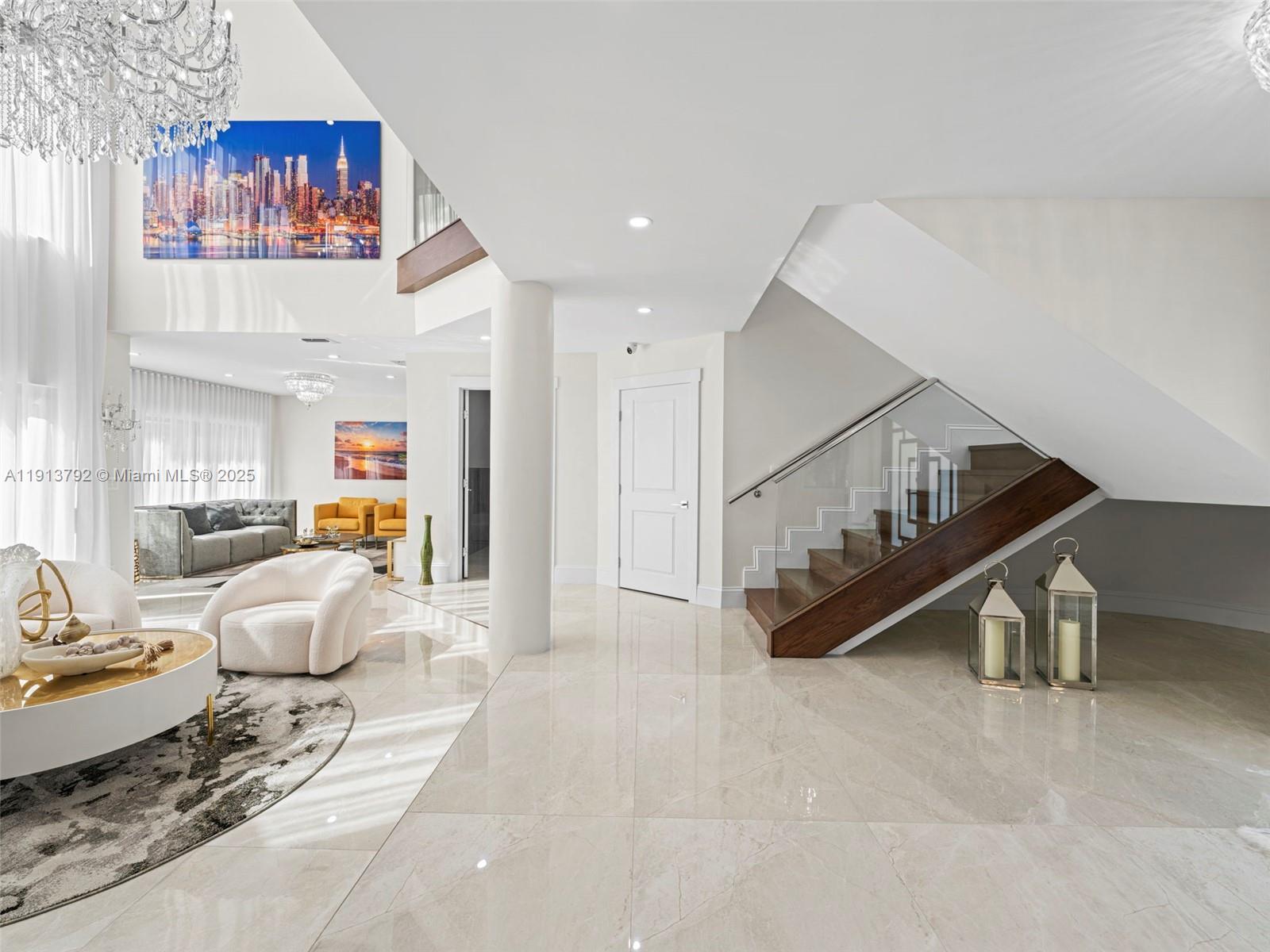 6180 Pine Tree Drive Miami Beach, FL 33140 - Photo 14 of 100 a living room with furniture and a book shelf