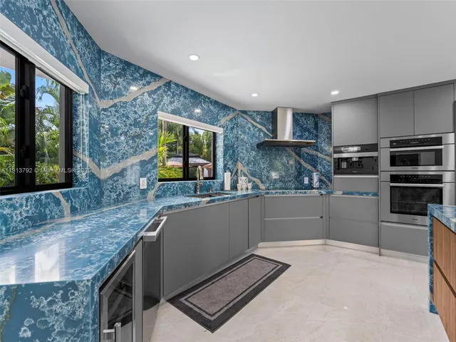 a bedroom with a large bed and a large window