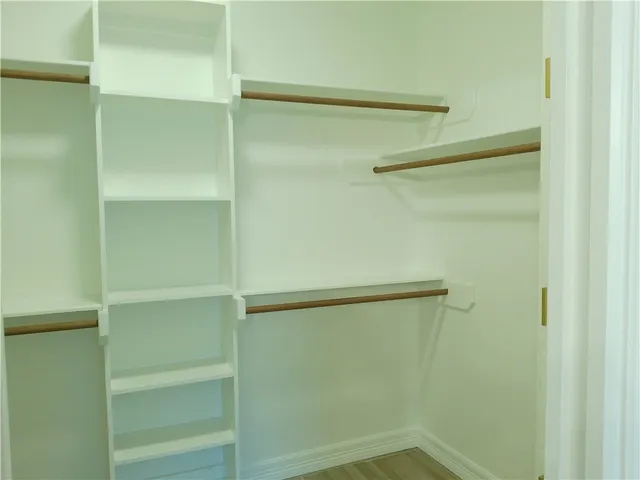 a view of an empty walk in closet