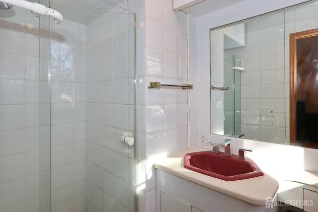 a bedroom with a bed and a shower