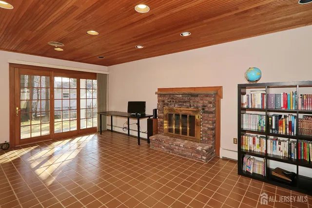 a view of a livingroom with furniture and staircase