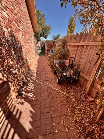 a view of a backyard with sitting area