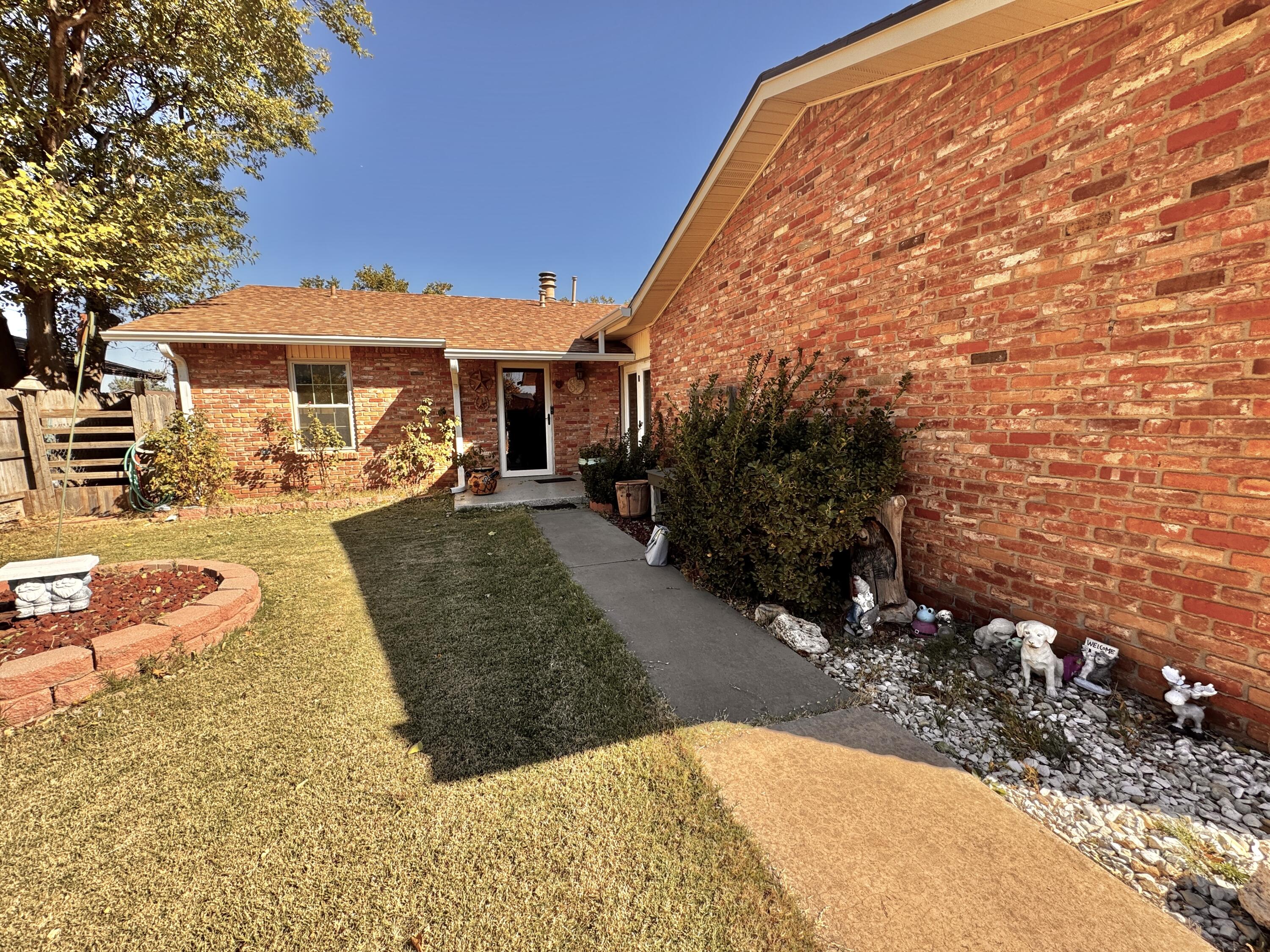 3902 Sides Street Plainview, TX 79072 - Photo 2 of 26 a view of a backyard with a patio