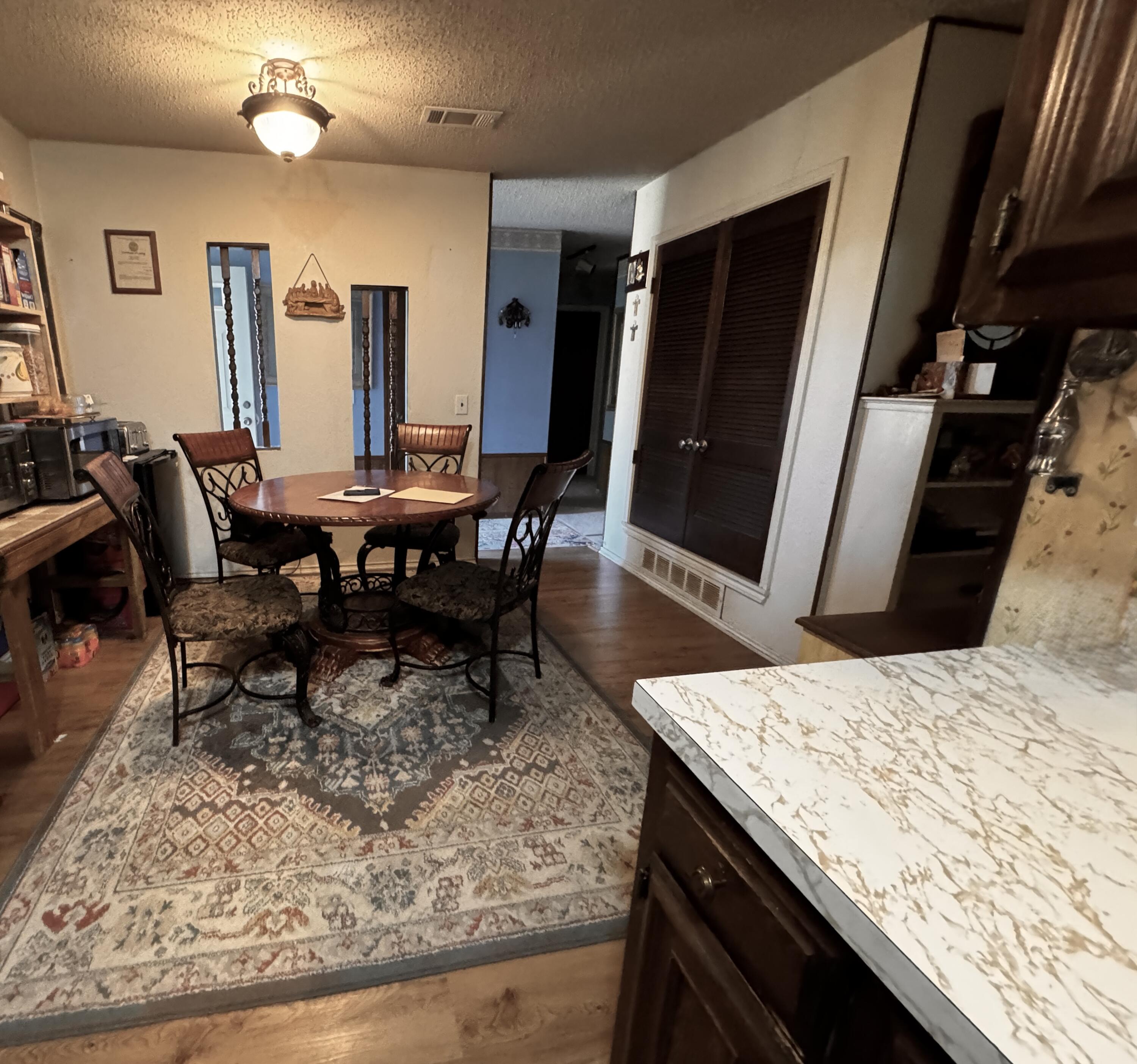 3902 Sides Street Plainview, TX 79072 - Photo 9 of 26 a view of a dining room with furniture