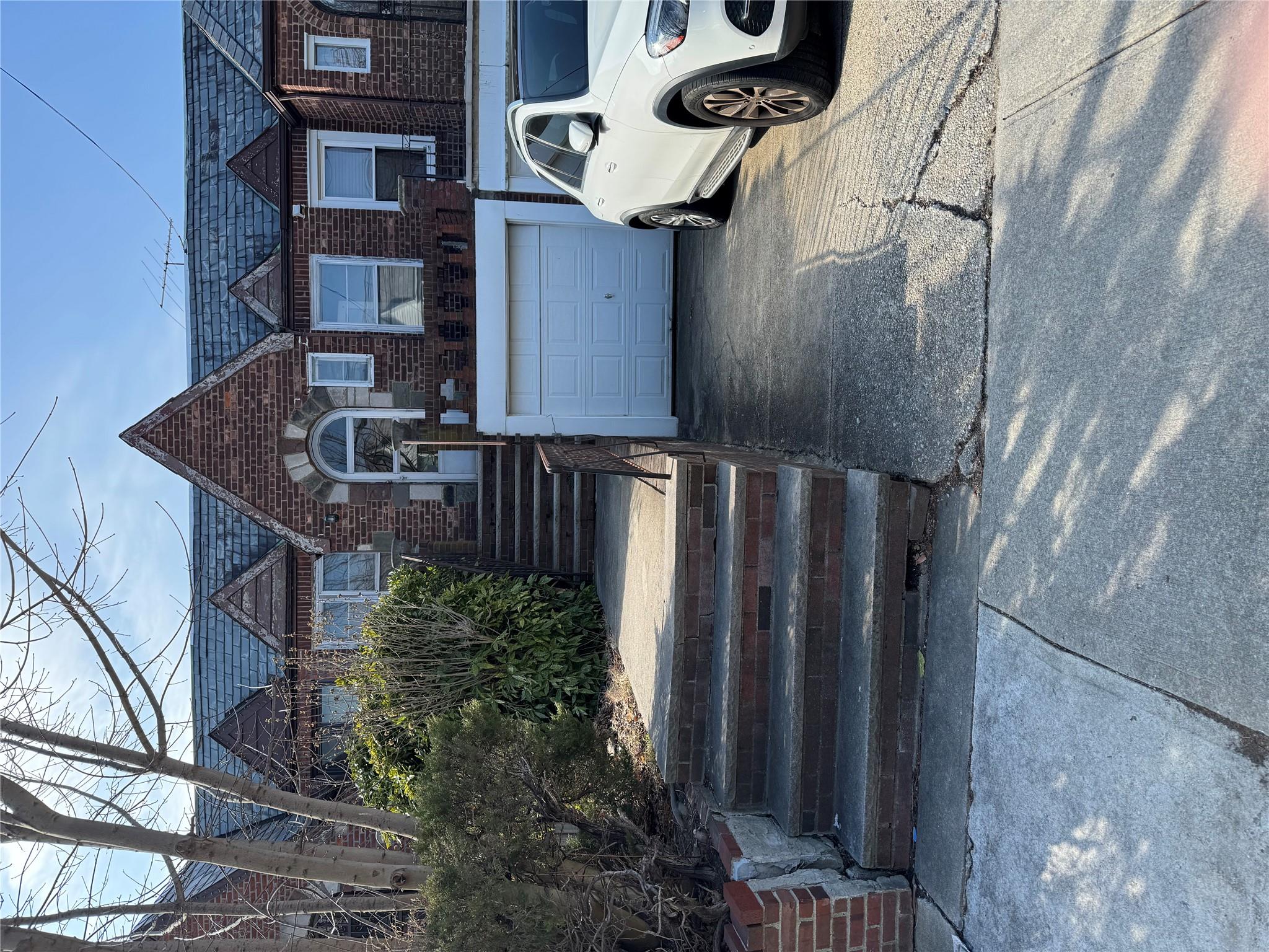 151-34 20th Road Queens, NY 11357 - Photo 1 of 1 a front view of a house with a garden