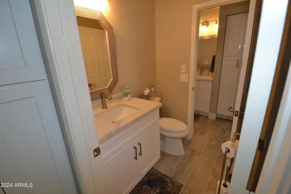 a outdoor living space with patio couch and a potted plant