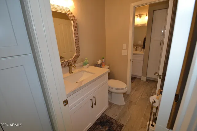 a outdoor living space with patio couch and a potted plant