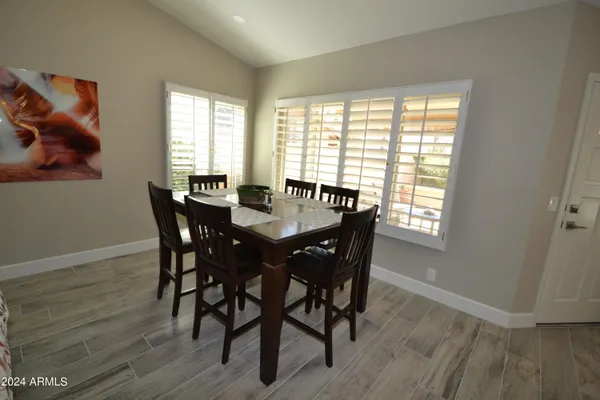 a view of a dining room with furniture and window