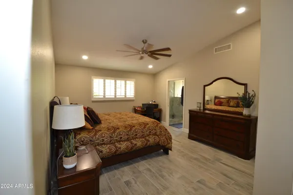 a bathroom with a sink a mirror and a shower