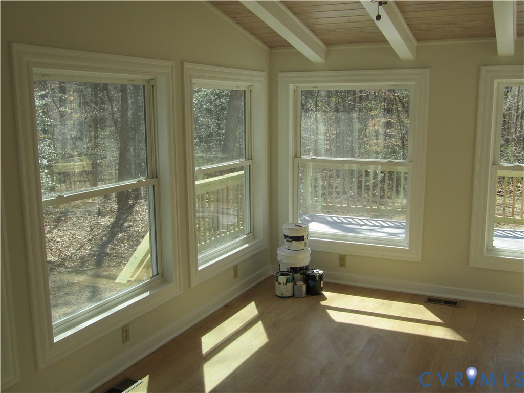 5705 Community House Road Columbia, VA 23038 - Photo 17 of 23 a room with couch and next to a window