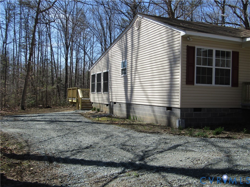 5705 Community House Road Columbia, VA 23038 - Photo 3 of 23 a front view of a house with a yard