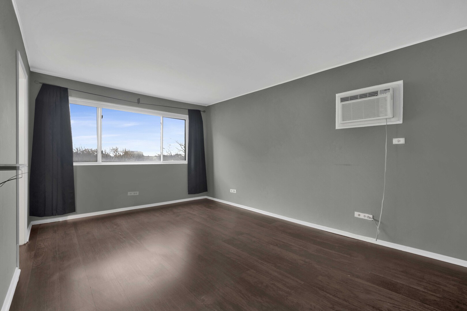 314 Lathrop Avenue, Unit 407 Forest Park, IL 60130 - Photo 14 of 27 a view of an empty room with wooden floor and a window