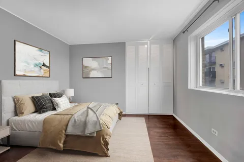 a bedroom with bed and window