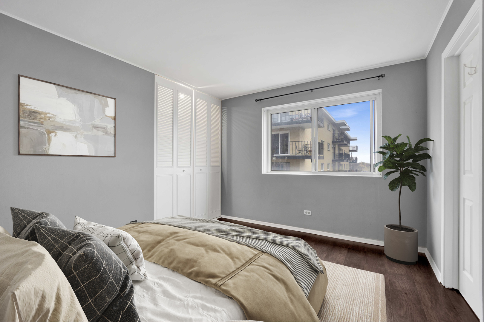 314 Lathrop Avenue, Unit 407 Forest Park, IL 60130 - Photo 22 of 27 a bedroom with a bed and a potted plant