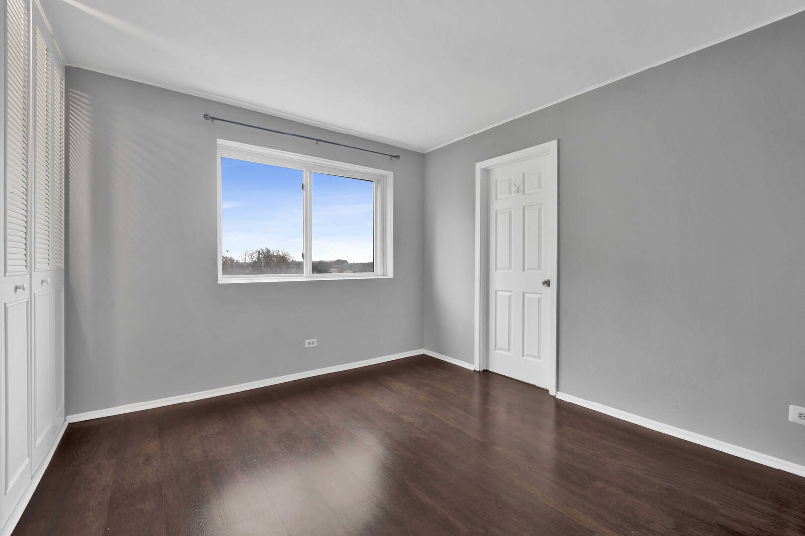 314 Lathrop Avenue, Unit 407 Forest Park, IL 60130 - Photo 24 of 27 a view of an empty room with wooden floor and a window