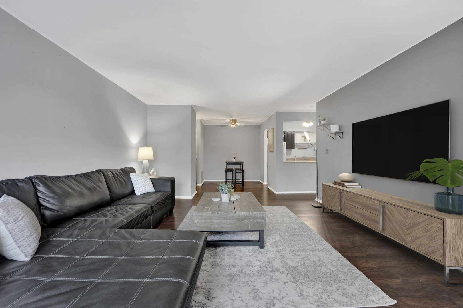 314 Lathrop Avenue, Unit 407 Forest Park, IL 60130 - Photo 4 of 27 a living room with furniture and a flat screen tv