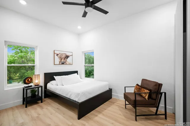 a bedroom with a bed and a window