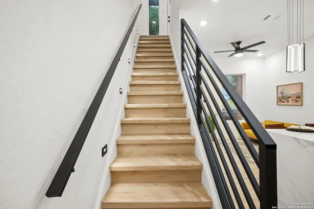 a view of a livingroom with wooden floor and a window