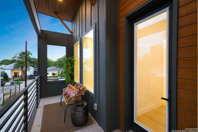 a hallway with table and chairs