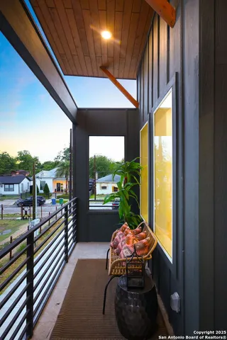 an aerial view of a house with swimming pool garden and patio