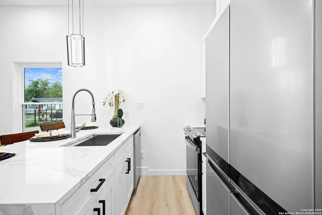 a kitchen with a sink and a window