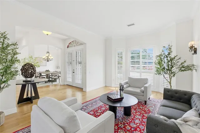 a dining room with furniture and wooden floor