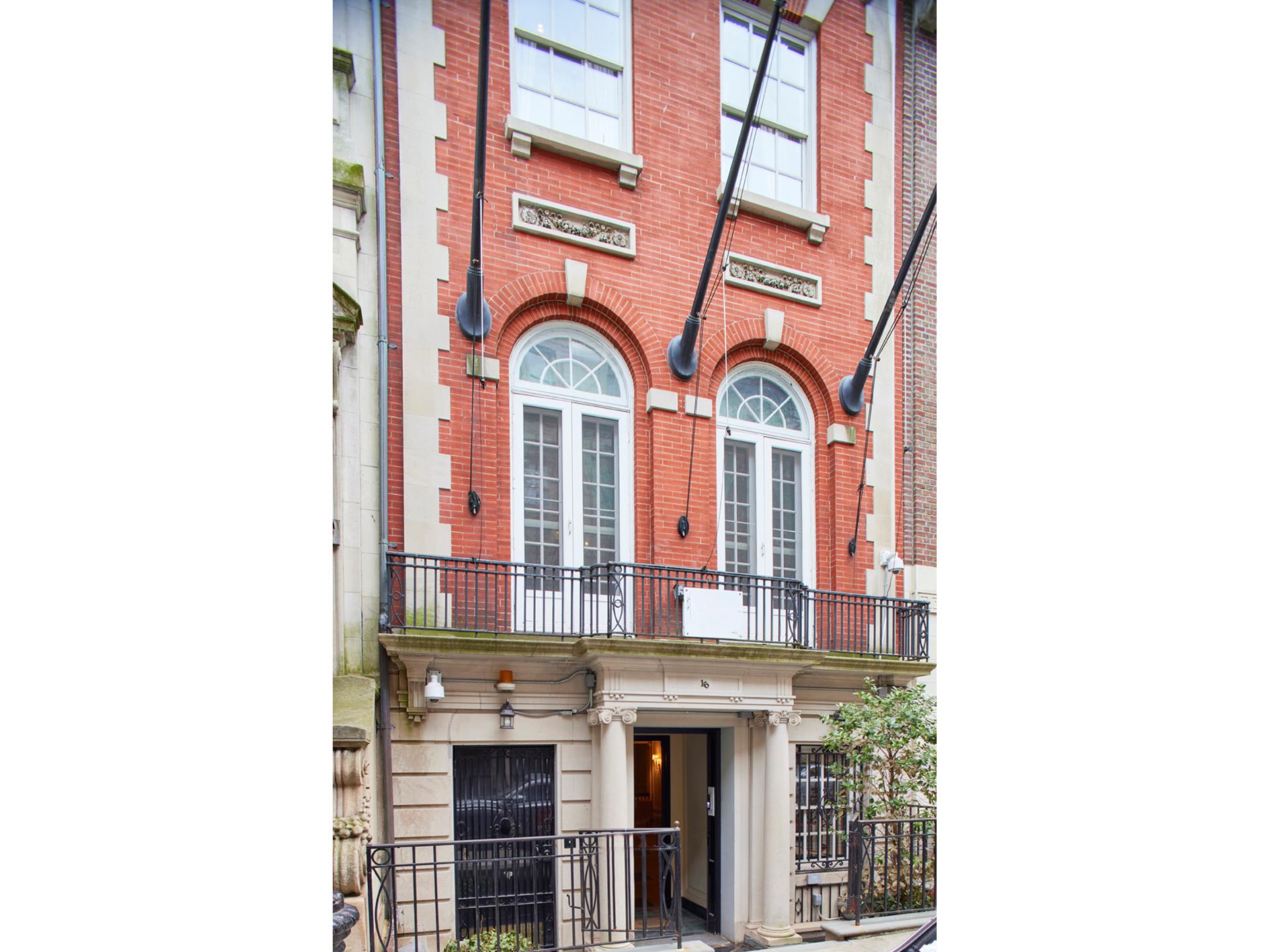 16 East 76th Street Manhattan, NY 10021 - Photo 2 of 12 a front view of a building